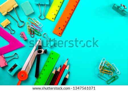 School stationery on a blue,green  background. Back to school. Royalty-Free Stock Photo #1347561071