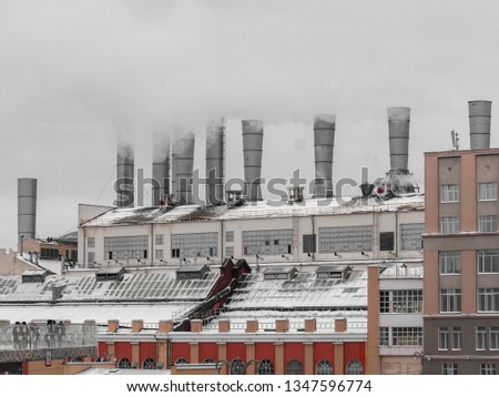 Smoking factories on the Moskva River embankment near the Moscow Kremlin in Moscow