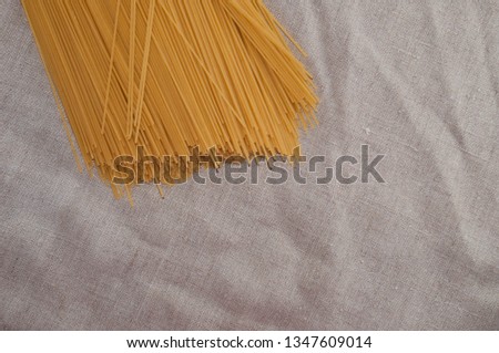 Raw spaghetti on gray background