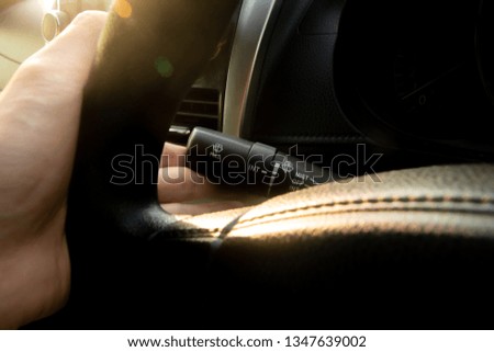 Hand push screen wiper button with warm light