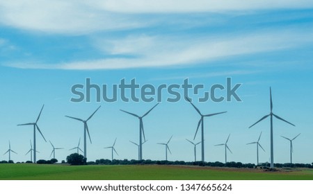 Pictures of wind energy mills from a car on the motorway