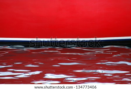 Colorful boat abstract sitting in the water.