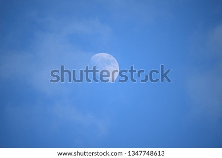 Day moon with blue sky