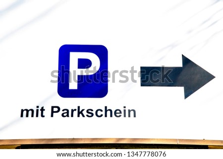 sign with P for Parking and text " with parking ticket"