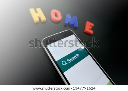 Search for a new home on a mobile device, conceptual photo