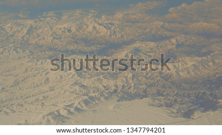 Beautiful snow-capped mountains from a bird's eye view. Zagros Mountains. Iran