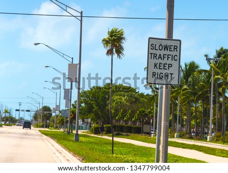 Slower Traffic Keep Right sign on Overseas Highway in Marathon Key. Southern Florida, USA