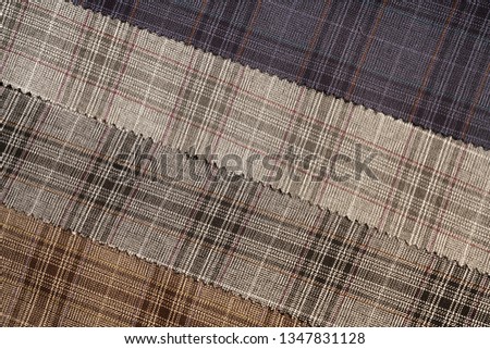 Tartan plaid natural cotton fabric. Seamless tiles texture for the background