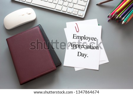 Text Employee appreciation day on white paper book and office supplies on wood desk / business concept Royalty-Free Stock Photo #1347864674