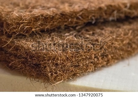 Mattress filler. Coconut coir, Nature para latex rubber, memory foam independent spring. Grated coconut shell for the production of mattresses. Background of Mattress filler. Royalty-Free Stock Photo #1347920075