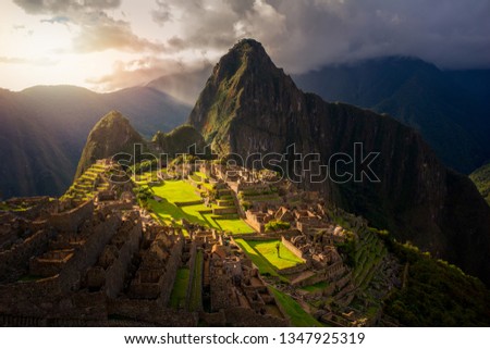 Majestic sunset over the Machu Picchu / Huayna Picchu mountain with Incan sacred city ruins. Beautiful landscape. Royalty-Free Stock Photo #1347925319