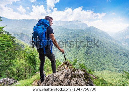 Rear view of successful hiker,enjoying breathtaking view