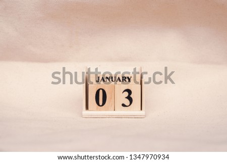January 3rd. Image of Jan 3 wooden color calendar  on white canvas background. empty space for text