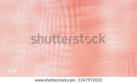 Abstract and blurred focus of beautiful and quality red polyester fabric with texture for textile, fashion beauty and blur background. Clothing and apparel concept.