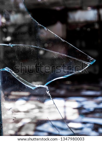 broken glass in old house on dark background 