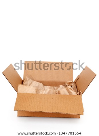 Cardboard box with wrapping paper inside isolated on white background, recycling concept