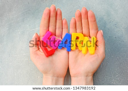 Learn concept with letters on a hands