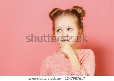 Close-up portrait of nice lovely attractive fascinating winsome little child girl with buns looking thoughtful up aside over pink background