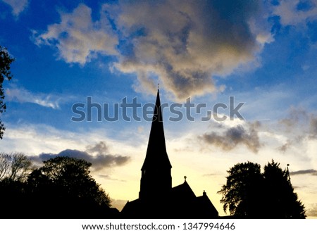 Sunrise behind a church spire