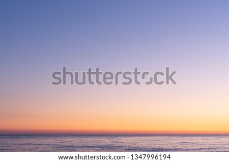 Colorful sky after sunset. Sunset on the background of the sea. Blue hour. Royalty-Free Stock Photo #1347996194
