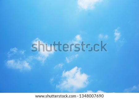 A pattern of white cloud in beautiful blue sky. This picture was shot in bright day light. It can be used as background. Nature and peaceful summer concept                           
