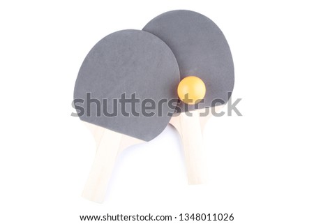 Table tennis rackets with ball isolated on white background