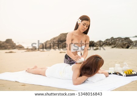 Young asian woman in beach spa.picture of Beautiful woman in spa salon getting massage on the beach in thailand.Spa, resort, beauty and health concept.