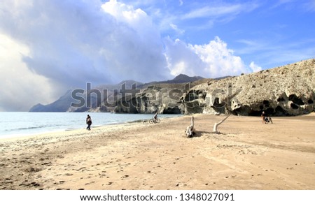 indiana Jones movie stage and the last crusade, tongues of lava eroded by the sea, the auto clastic gaps or pyroclastic andesite, The petrified wave, beach of Mónsul, Natural Park, Cabo de Gata, spain Royalty-Free Stock Photo #1348027091