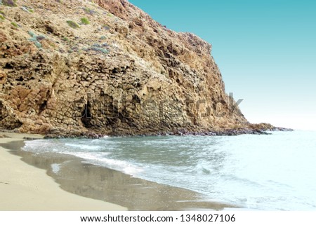 indiana Jones movie stage and the last crusade, tongues of lava eroded by the sea, the auto clastic gaps or pyroclastic andesite, The petrified wave, beach of Mónsul, Natural Park, Cabo de Gata, spain Royalty-Free Stock Photo #1348027106