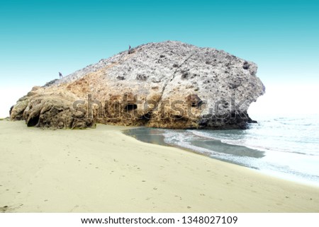 indiana Jones movie stage and the last crusade, tongues of lava eroded by the sea, the auto clastic gaps or pyroclastic andesite, The petrified wave, beach of Mónsul, Natural Park, Cabo de Gata, spain Royalty-Free Stock Photo #1348027109