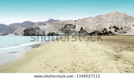 indiana Jones movie stage and the last crusade, tongues of lava eroded by the sea, the auto clastic gaps or pyroclastic andesite, The petrified wave, beach of Mónsul, Natural Park, Cabo de Gata, spain Royalty-Free Stock Photo #1348027112