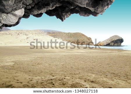 indiana Jones movie stage and the last crusade, tongues of lava eroded by the sea, the auto clastic gaps or pyroclastic andesite, The petrified wave, beach of Mónsul, Natural Park, Cabo de Gata, spain Royalty-Free Stock Photo #1348027118