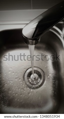 Kitchen sink and water stream