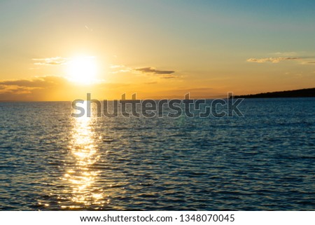 Beautiful sunset over the sea, beach on the island Pag in Croatia, wallpaper, copy space