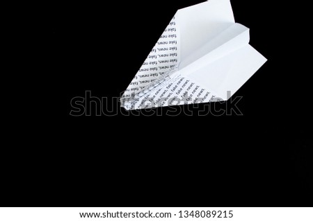 paper airplane on a black background