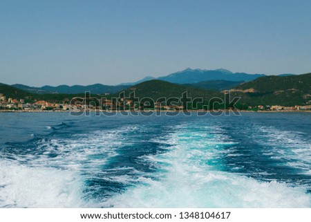 Yacht trail on sea surface behind fast moving yacht. Point of view picture. Background concept for summer vacations.
