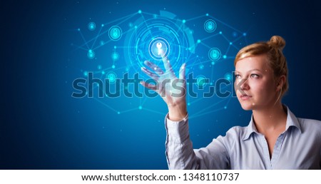 Woman touching hologram screen displaying keys and locks