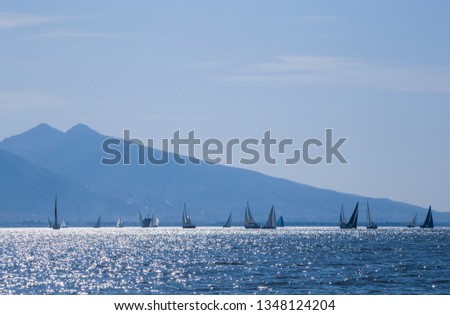 Sailing boats on the horizon in Aegean Sea. Sailing race. Sea sports. 