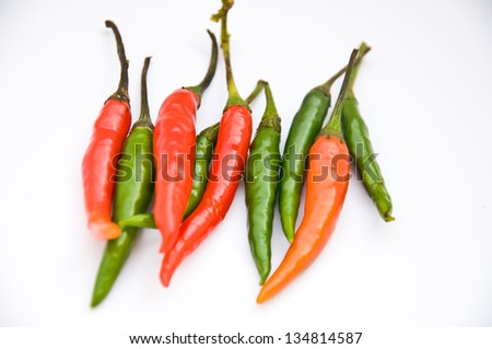 red and green chili on white background
