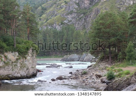 View of the Katun River. Altai Republic, Russia. Beautiful nature of the Altai Republic. Beautiful landscape with a turquoise river and the Altai Mountains