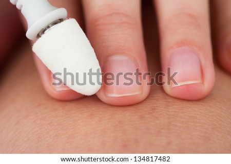 Close-up Photo Of A Hand Manicuring Nails