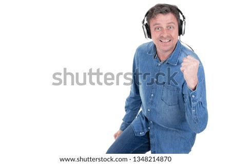 fun handsome man wearing headphone and enjoy music over isolated white Background