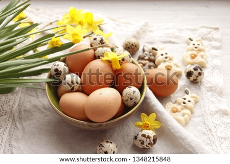 Easter background. Chicken Eggs and Chocolate Hares
