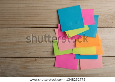 Colorful sticky notes on the wooden desk