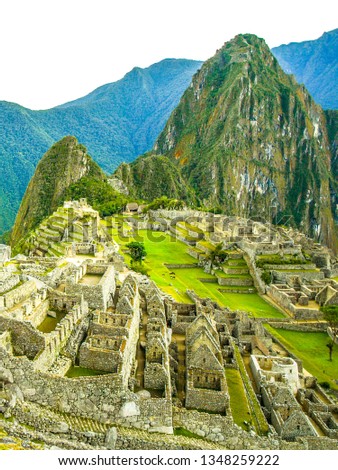 Machu Picchu, peruvian lost city of Incas situated on mountain ridge above Sacred Valley of Urubamba River in Cusco Region, Peru. UNESCO World Heritage and one of the New Seven Wonders of the World