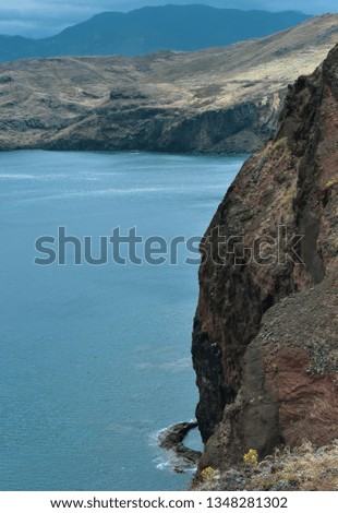Steep cliffs in Madeira and the Atlantic Ocean