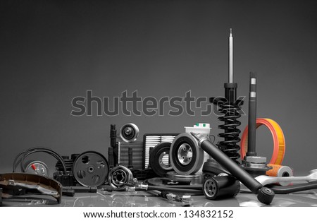 New car parts on a gray background Royalty-Free Stock Photo #134832152
