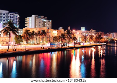 Miami south beach street view with water reflections at night