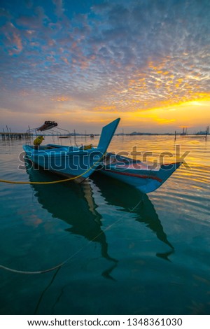 Boat parking with beautiful light of sunset. This photo take in the one of beautiful fisherman village Batam island Indonesia.