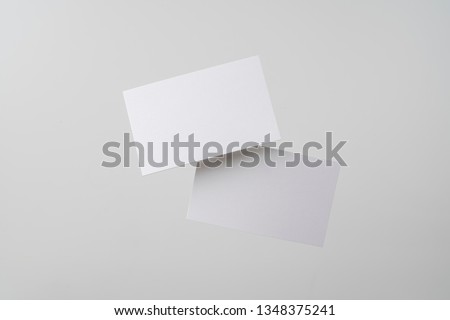 Design concept - top view of 2 surreal white business card float on mid air isolated on white background for mockup, it's real photo, not 3D render